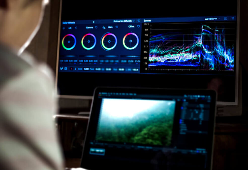 6520394a0740d67366b6852f_young_man_edit_video_in_dark_studio_using_color_grading_tools